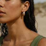 Gold hoop earrings on a woman 