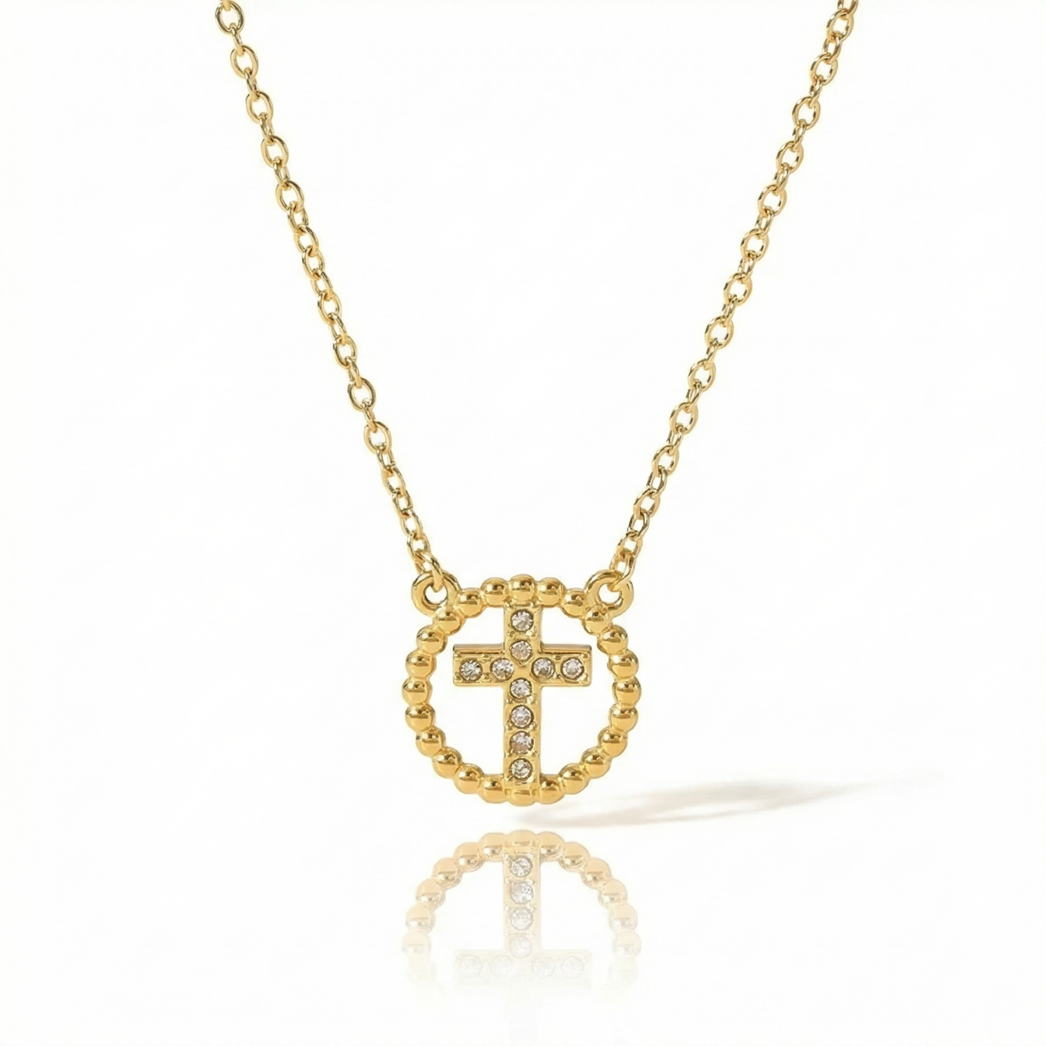 Gold necklace with a cross pendant on a white background
