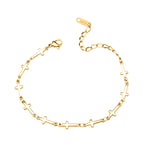 Gold bracelet with links made of mini crosses on a white background