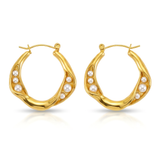 Gold hoop earrings with pearl accents on a white background