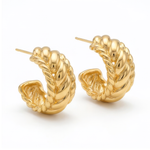Gold hoop earrings on a white background