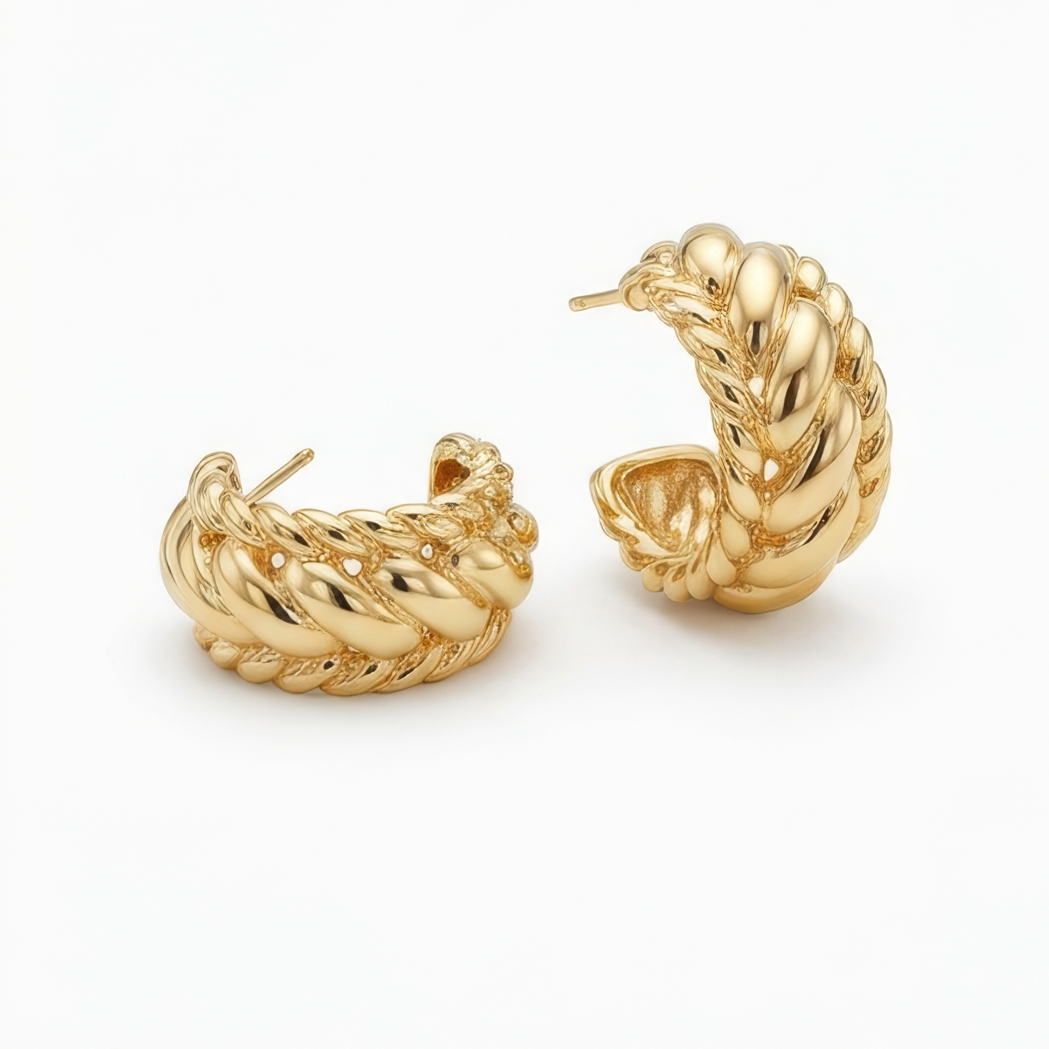 Pair of gold hoop earrings on a white background