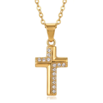 Gold cross necklace with embedded white rhinestones on a white background