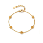 Gold bracelet with five stationary gold rosebud designs spaced out on the chain on a white background