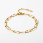 Gold paperclip chain bracelet on a white background
