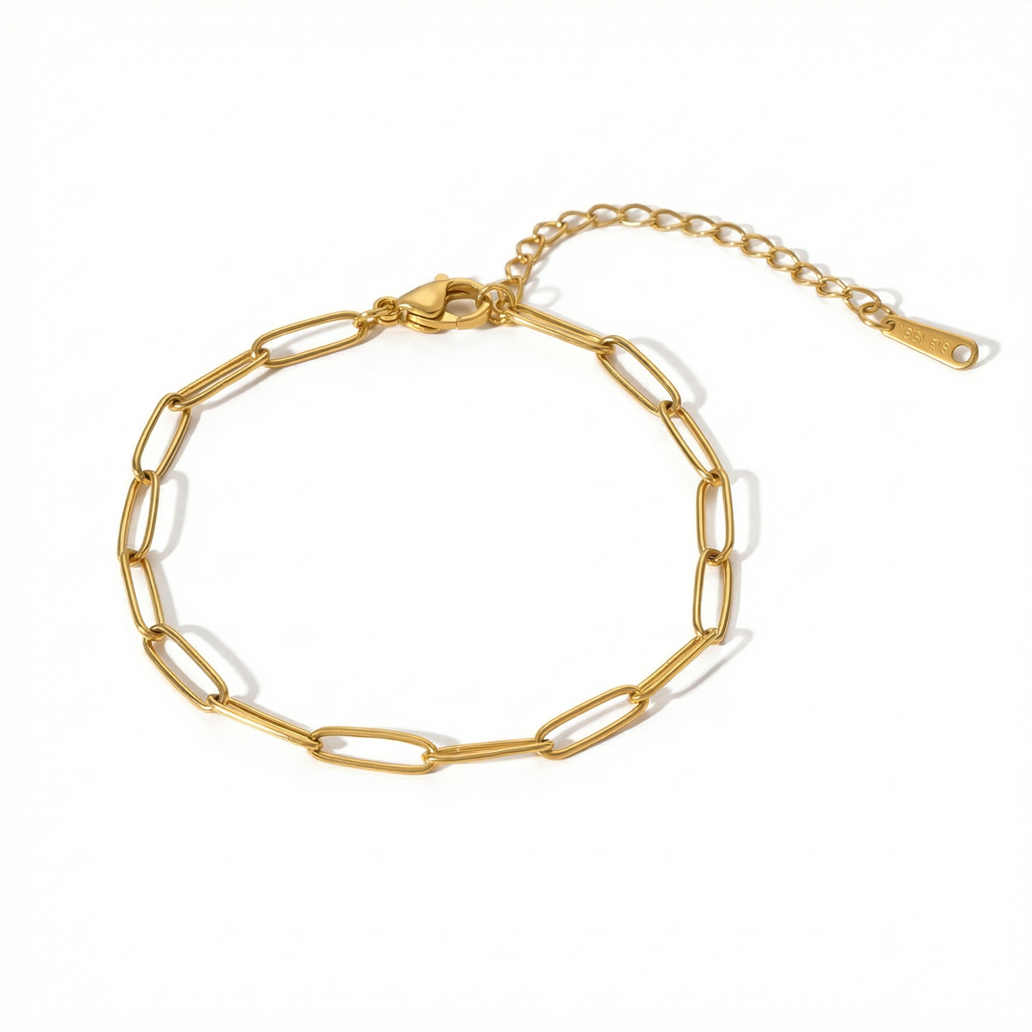 Gold paperclip chain bracelet on a white background